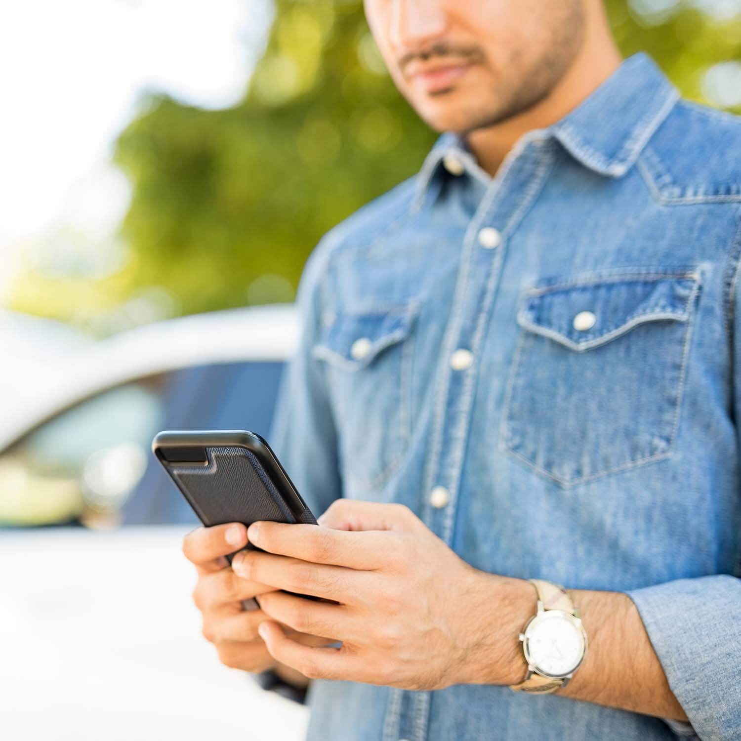 Man getting text notifications on his phone